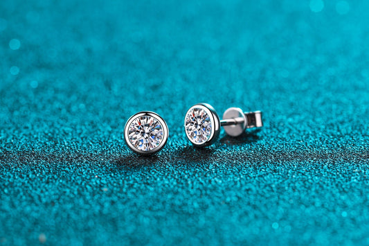 Bezel solitaire studs, close up